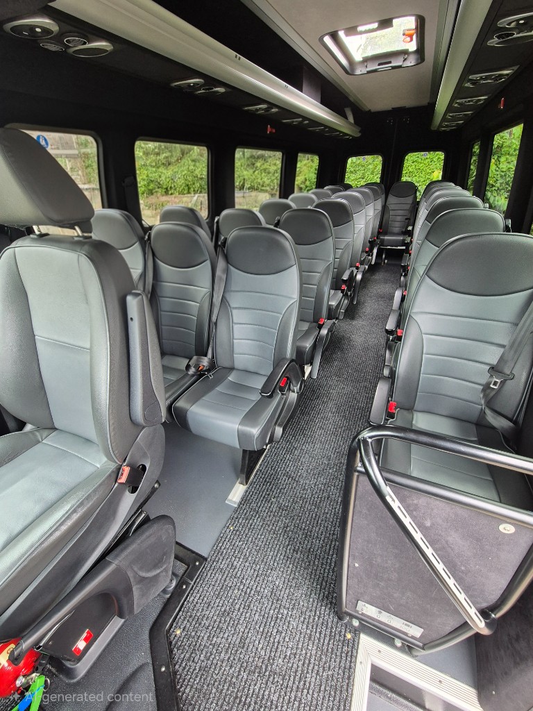 Interior aisle and seating rows of Ace Cabs 22-seater coach for large group hire