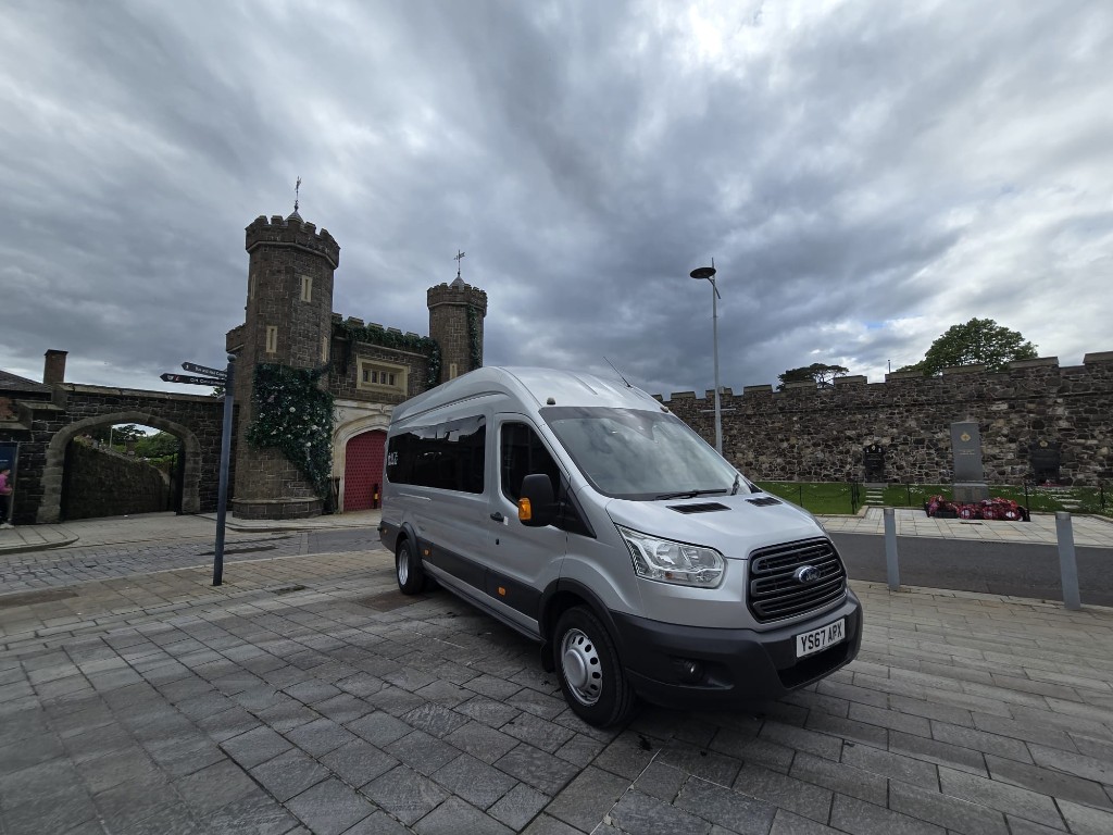 Silver Ford Transit 16-seater minibus from Ace Cabs Antrim, group transport and school runs across Northern Ireland