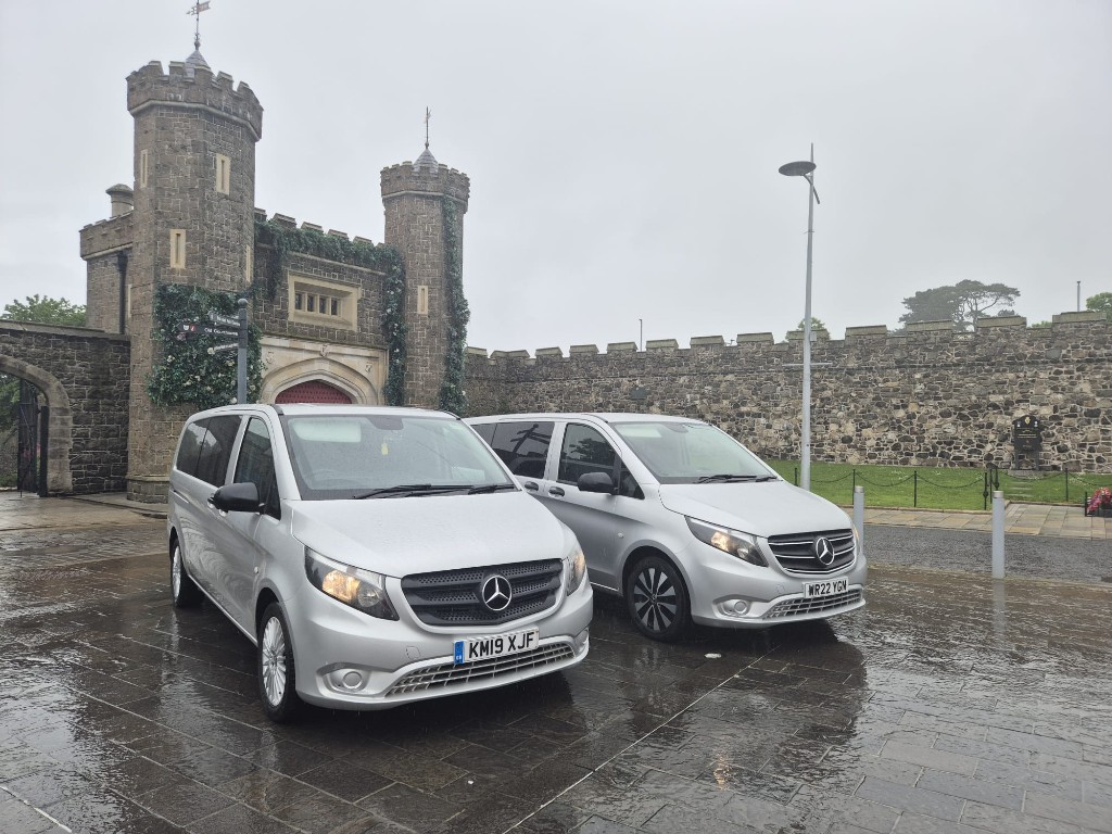 Two silver Mercedes Vito MPVs from Ace Cabs parked at Antrim gatehouse, 8-seater group transport in Northern Ireland