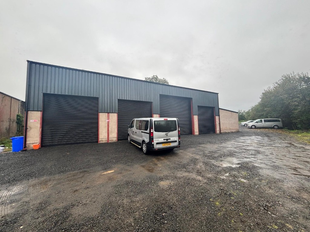 Ace Cabs service centre yard in Antrim with fleet vehicles ready for workshop maintenance