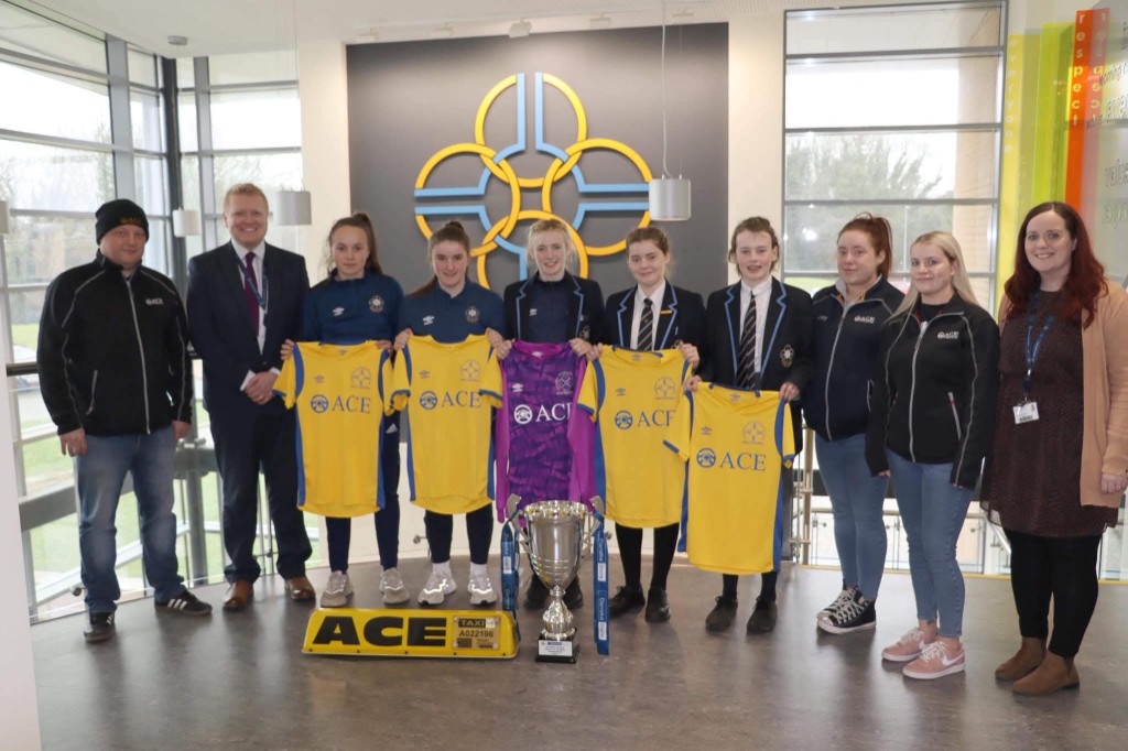 Parkhall Integrated College girls team with Ace Cabs sponsored jerseys at kit presentation